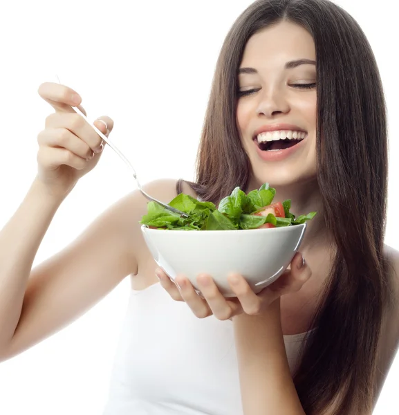 Smiling woman is eating salat — Stock Photo, Image