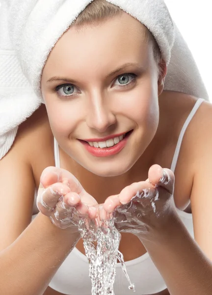Smiling woman is washing her face — Stock Photo, Image