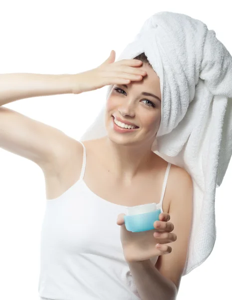 Woman is applying cream — Stock Photo, Image