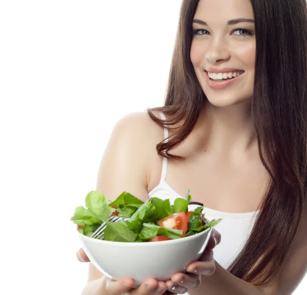 Sorridente donna sta mangiando salat — Foto Stock