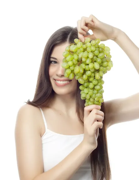 Vrouw met groene druiven — Stockfoto