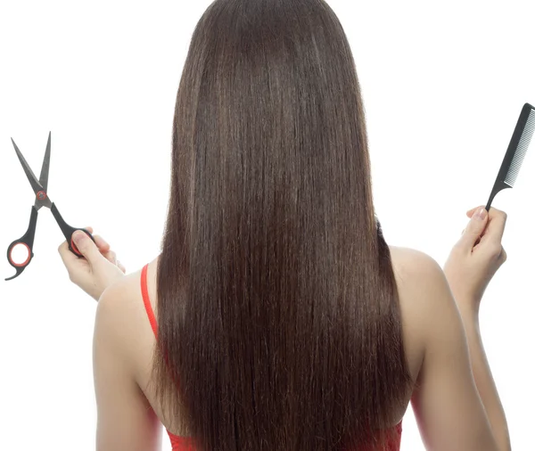 Woman's back with comb and scissors — Stock Photo, Image