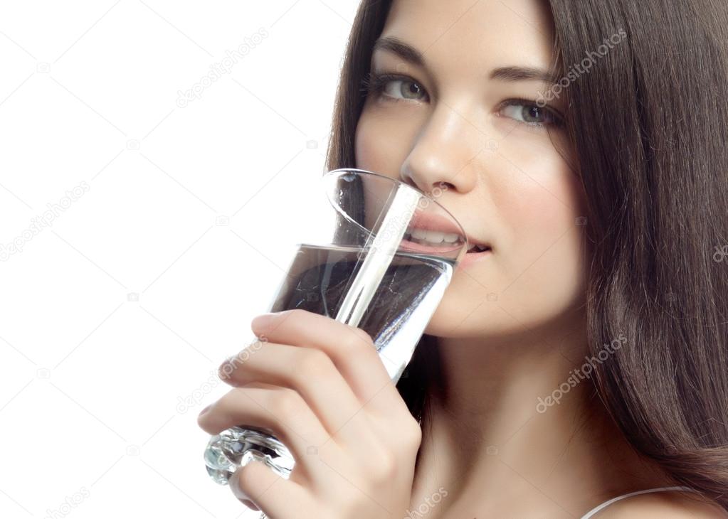 Smiling woman with glass of water