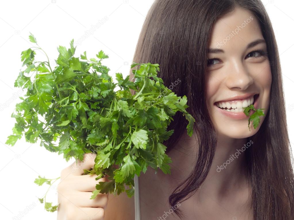 Smiling woman with parsley