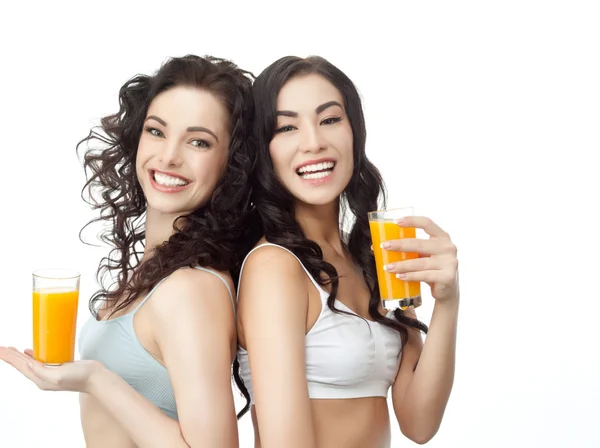 Χαμογελαστά γυναίκες πίνουν χυμό πορτοκαλιού — Φωτογραφία Αρχείου