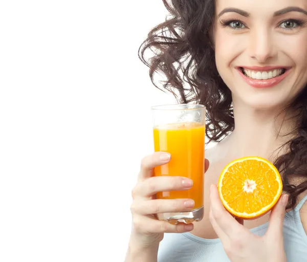 Smiling woman is drinking juice — Stock Photo, Image