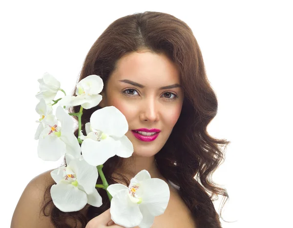 Mulher com flor de orquídeas — Fotografia de Stock