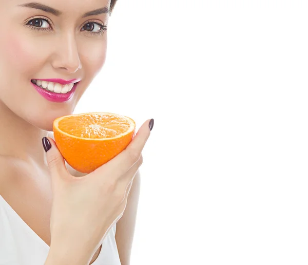 Woman is eating orange — Stock Photo, Image