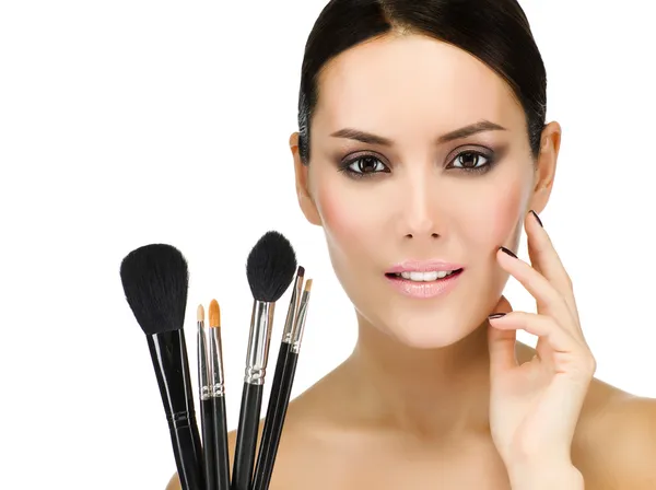 Woman with make up brushes — Stock Photo, Image