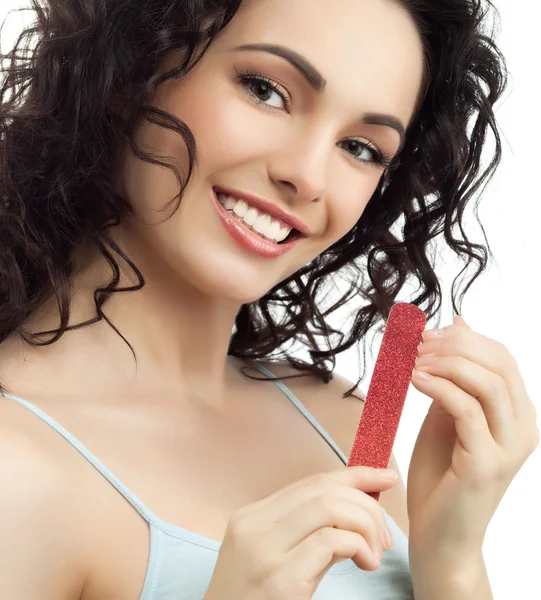 Brunette woman with nail file — Stock Photo, Image