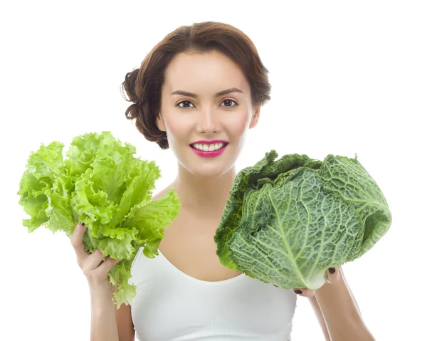 Женщина с салатом и капустой — стоковое фото