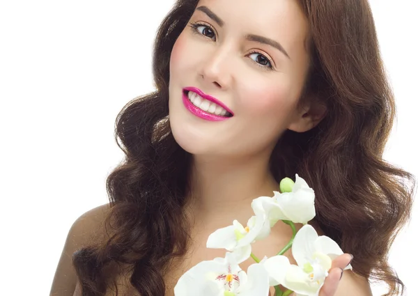 Mulher com flor de orquídeas — Fotografia de Stock