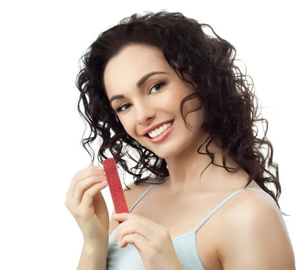 Brunette woman with nail file — Stock Photo, Image