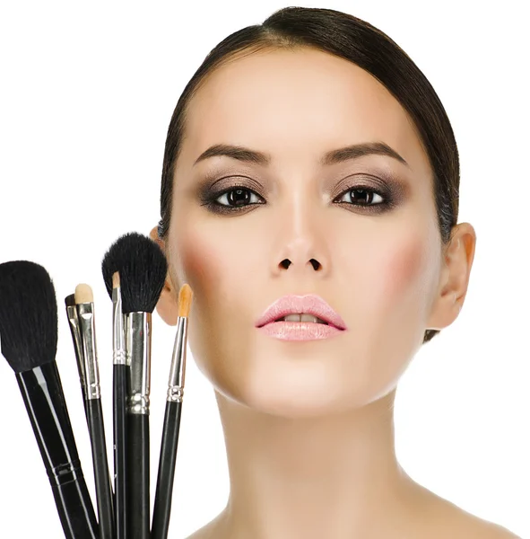 Woman with make up brushes — Stock Photo, Image