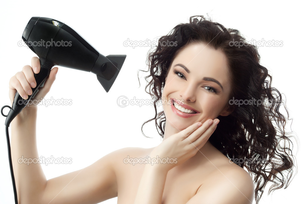 Woman brunette with hairdryer