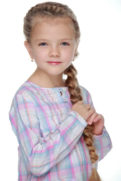 Retrato de uma menina bonita com um pigtail — Fotografia de Stock