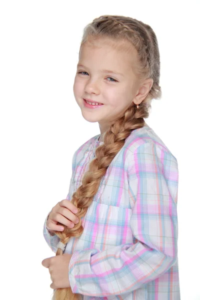 Retrato de uma menina bonita com um pigtail — Fotografia de Stock