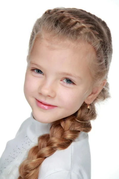 Retrato de uma menina bonita com um pigtail — Fotografia de Stock