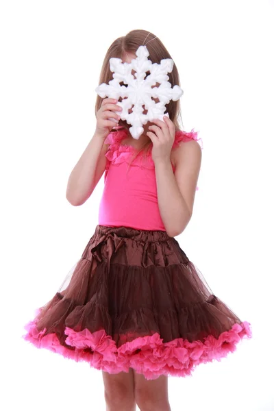 Christmas flicka med snöflinga i händer — Stockfoto