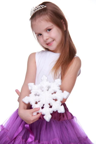 Menina de Natal com floco de neve nas mãos — Fotografia de Stock