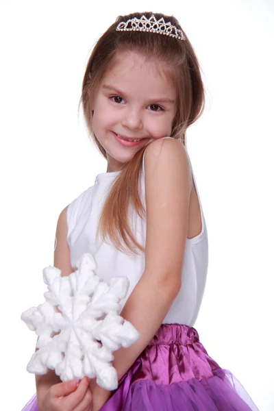 Christmas flicka med snöflinga i händer — Stockfoto