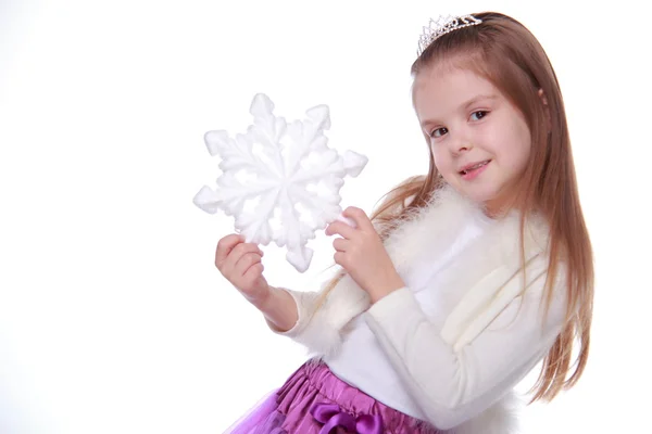 Chica de Navidad con copo de nieve en las manos — Foto de Stock