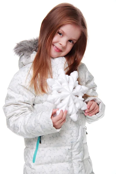 Christmas girl with snowflake in hands — Stock Photo, Image
