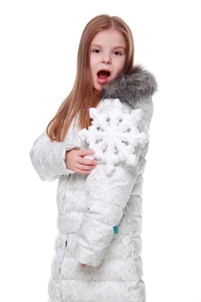 Menina de Natal com floco de neve nas mãos — Fotografia de Stock