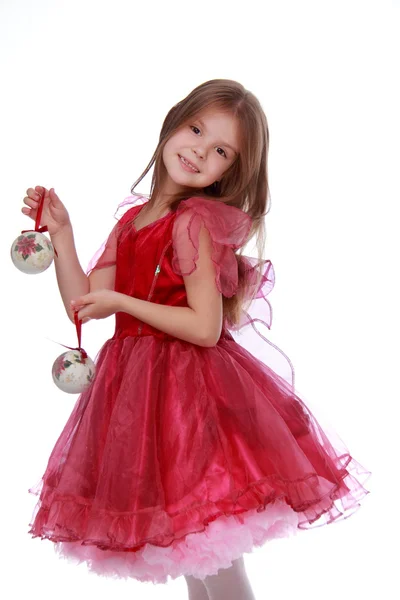 Menina com um brinquedo de Natal — Fotografia de Stock