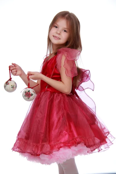 Bambina con un giocattolo di Natale — Foto Stock