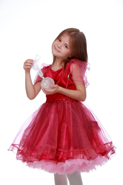 Little girl with a Christmas toy — Stock Photo, Image