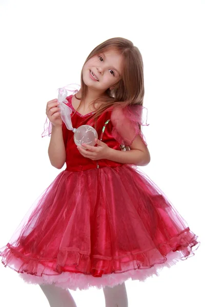 Little girl with a Christmas toy — Stock Photo, Image