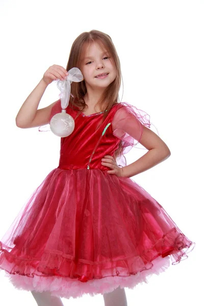 Niña con un juguete de Navidad — Foto de Stock