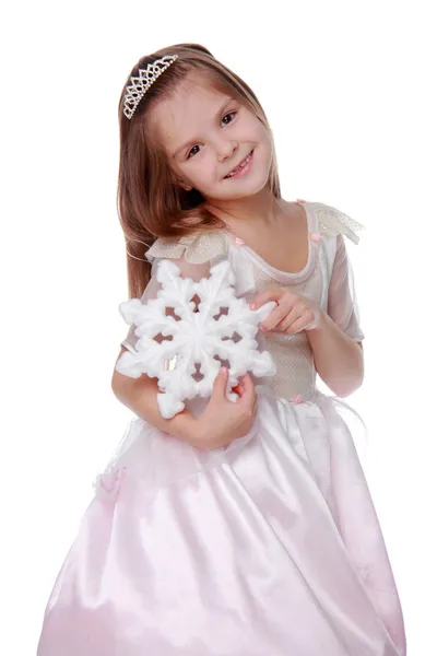 Маленькая девочка со снежинкой — стоковое фото