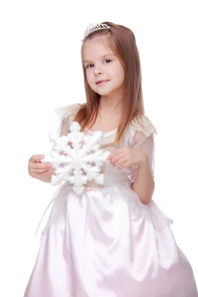Chica de Navidad con copo de nieve en las manos —  Fotos de Stock