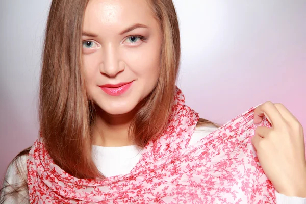 Beautiful girl in pink scarf — Stock Photo, Image