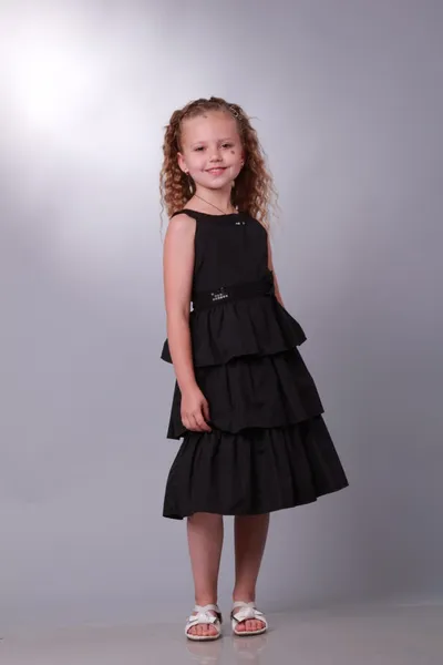 Little girl in a black dress — Stock Photo, Image