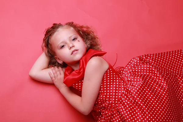 Little girl in a polka dot dress — Stock Photo, Image