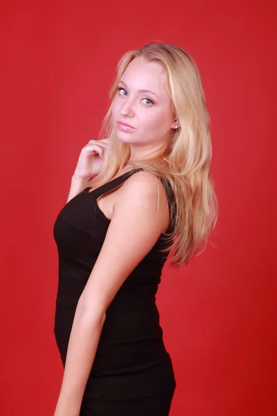 Blonde in a black dress — Stock Photo, Image