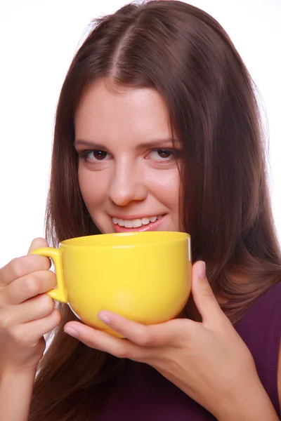 Woman drinking from a cup of coffee — Stock Photo, Image