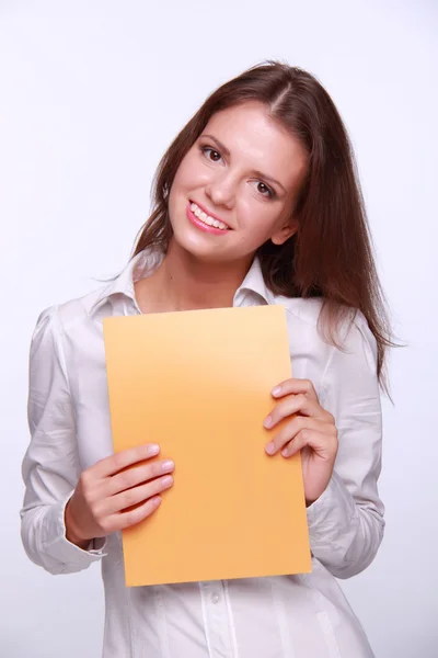 Brunette with yellow paper in his hands — Stock Photo, Image