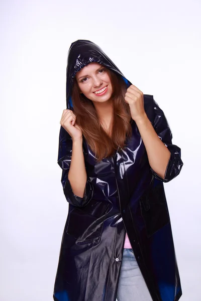 Beautiful young woman in raincoat — Stock Photo, Image