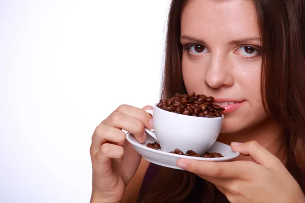 Young woman holding a cup of coffee beans Stock Picture