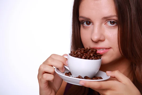 Young woman holding a cup of coffee beans Stock Photo