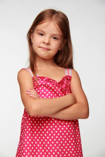 Pretty girl in a pink dress with polka dots — Stock Photo, Image