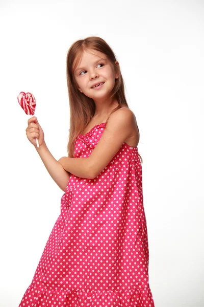 棒棒糖粉红色连衣裙的小女孩 — 图库照片