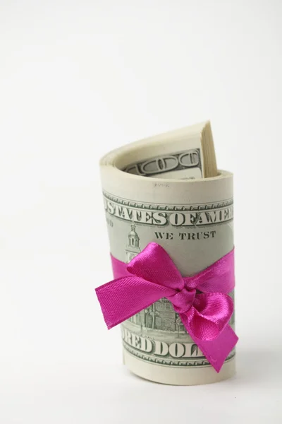 US dollar wrapped by purple ribbon — Stock Photo, Image
