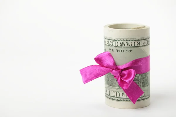 US dollar wrapped by purple ribbon Royalty Free Stock Photos