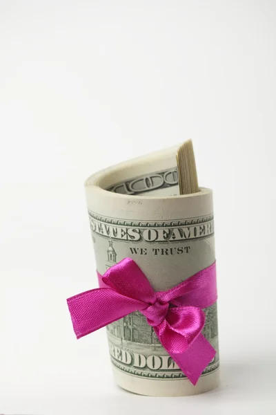 US dollar wrapped by purple ribbon Stock Photo