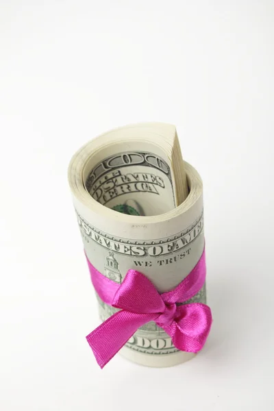 US dollar wrapped by purple ribbon Royalty Free Stock Images